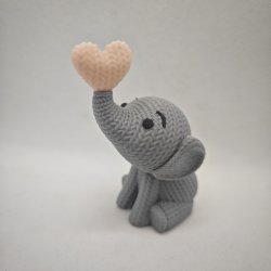 Siddende elefant med hjerte