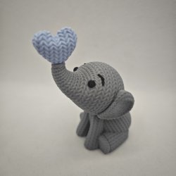 Siddende elefant med hjerte