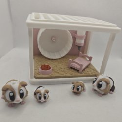 Hamsterbur med hamsterfamilie