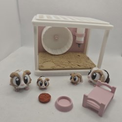 Hamsterbur med hamsterfamilie